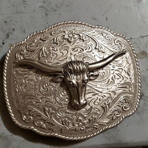 Silver colored steel longhorn belt buckle